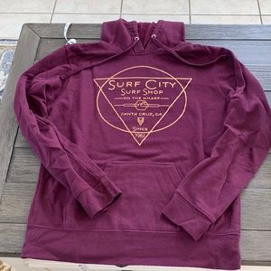 5/$20 Santa Cruz hoodie size S, maroon with gold lettering. In good condition.